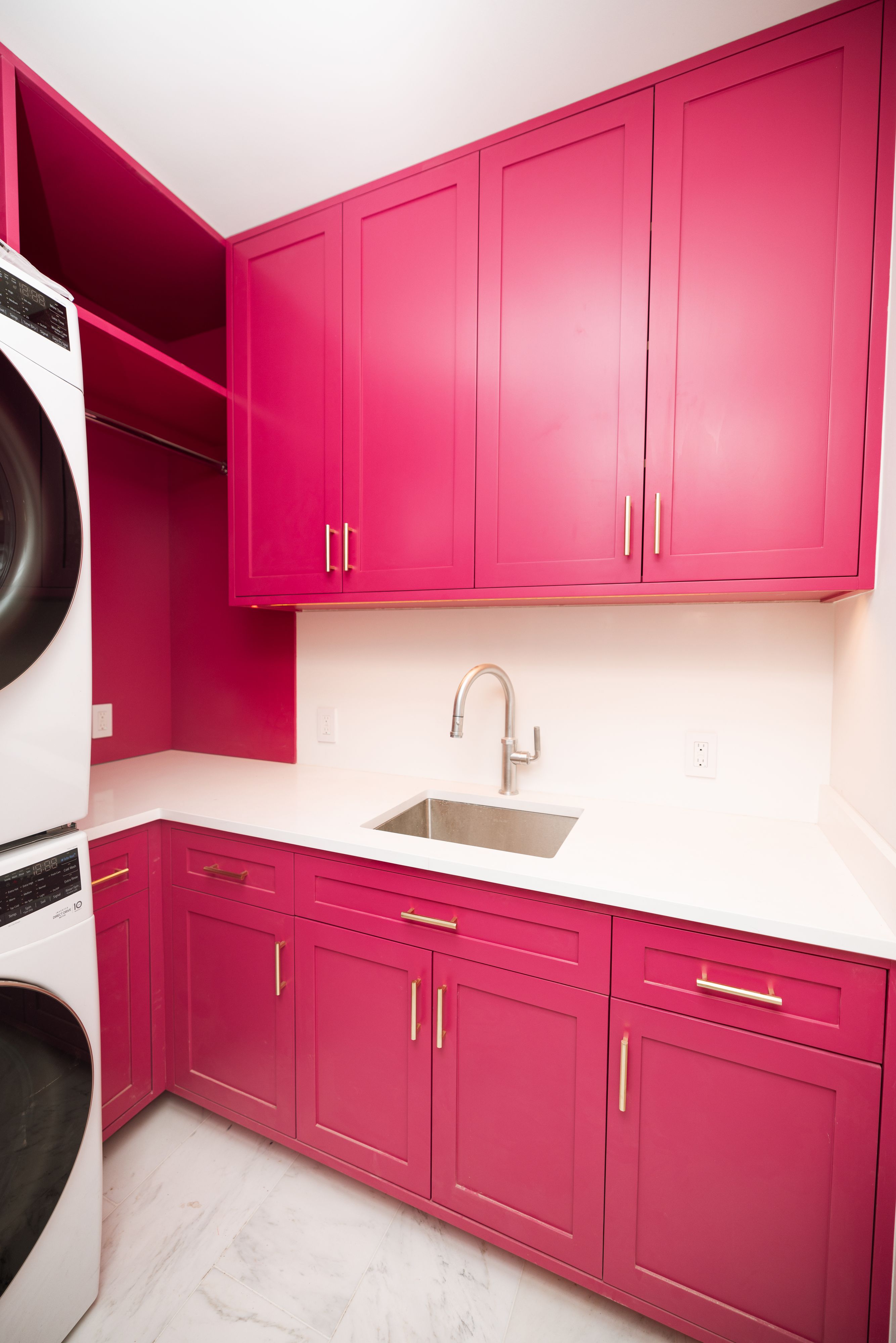 Pink Lacquer Laundry Room by NYC Millwork