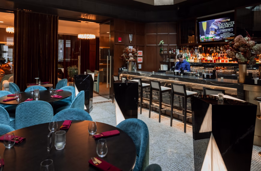 Natural wood finishes introduce texture and warmth that soften large commercial interiors.